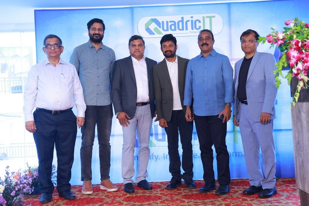 QuadricIT leaders and guests on stage at the opening of the Delivery and Innovation Centre in Hyderabad